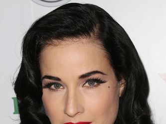 celebrities with black hair and green eyes