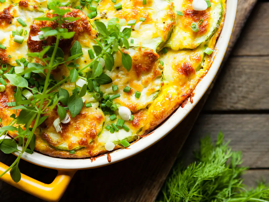 gratin de courgettes aux carottes et aux lardons