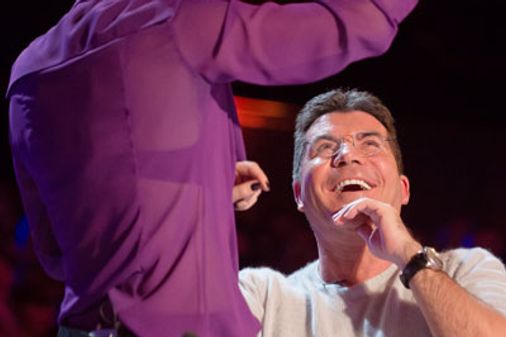 Amanda Holden pours water over Simon Cowell on BGT 2013