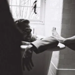Robert Pattinson poses in bathtub for Dior campaign