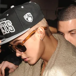 Justin Bieber denies spitting on fans as he's cleared of hit and run