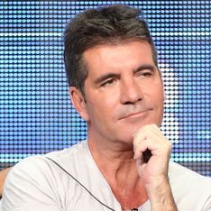 Simon Cowell brushes off baby rumours at One Direction concert
