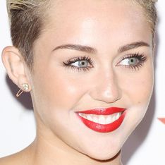 Underaged Miley Cyrus caught boozing and snogging Benji Madden