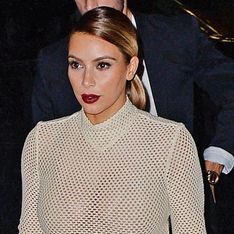 Kim Kardashian shows off her post-baby breasts in see-through nude top