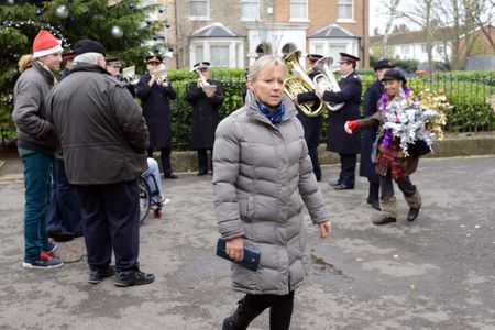 A distracted Carol wanders through the Square