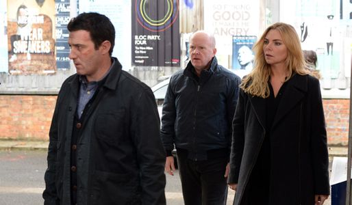 Ronnie and Phil watch Carl leave Walford