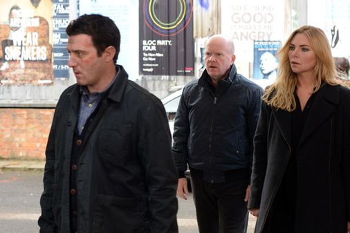 Ronnie and Phil watch Carl leave Walford