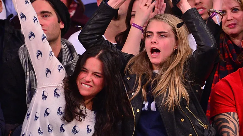 Cara Delevingne and Michelle Rodriguez cuddle up and kiss at New York Knicks game
