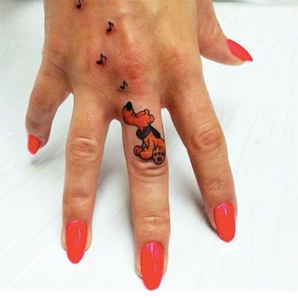 Whimsical Disney Finger Tattoo