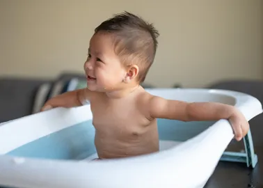 Support pliable pour baignoire bébé an