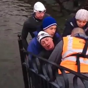 An exhausted Davina McCall is dragged out of lake during Sport Relief challenge